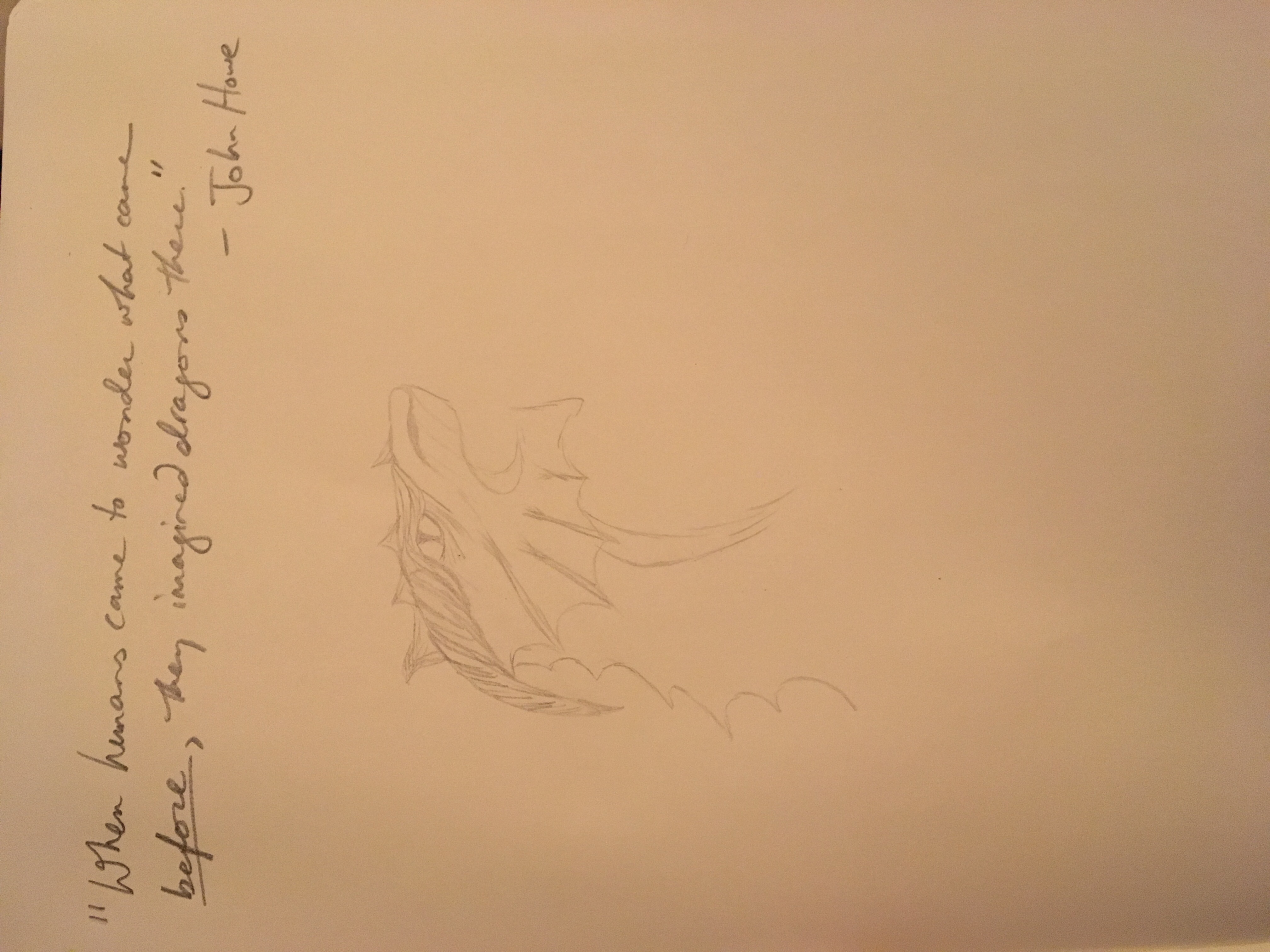 Sketch of a fierce dragon in pencil hand, half complete