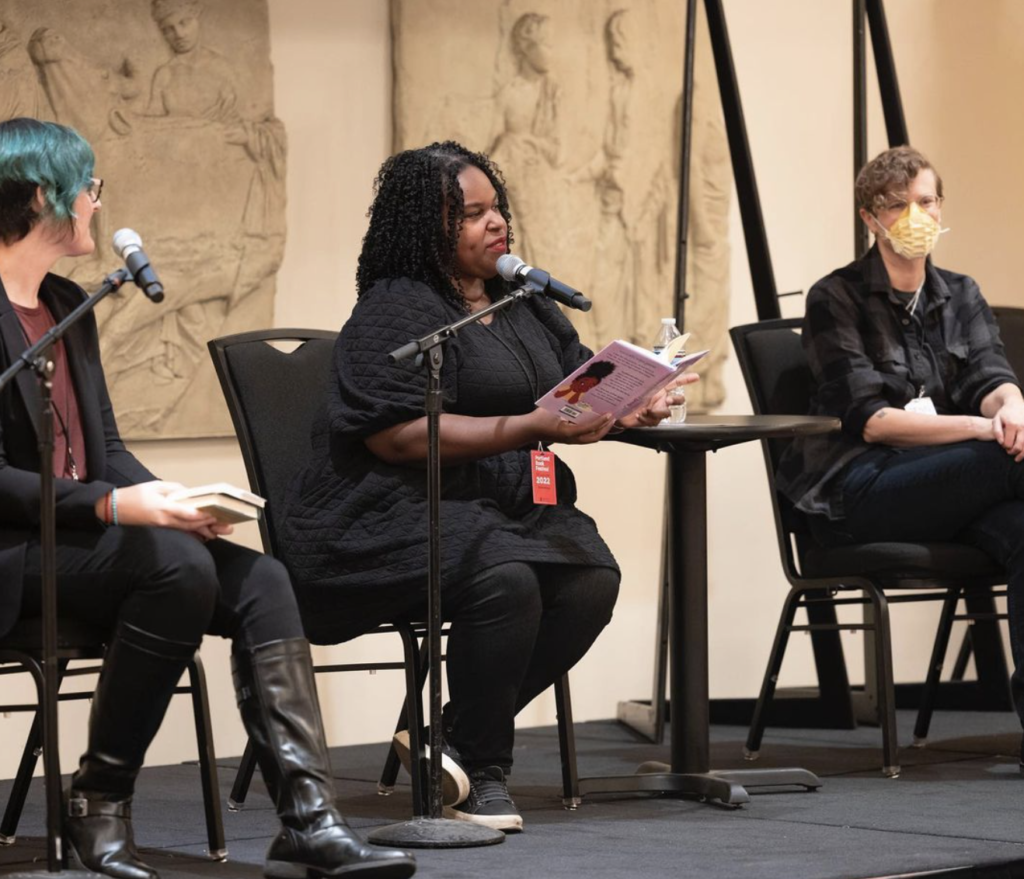 Kate onstage with Renée Watson and Jenn Reese at the Portland Book Festival in a photo By Shawnte Sims